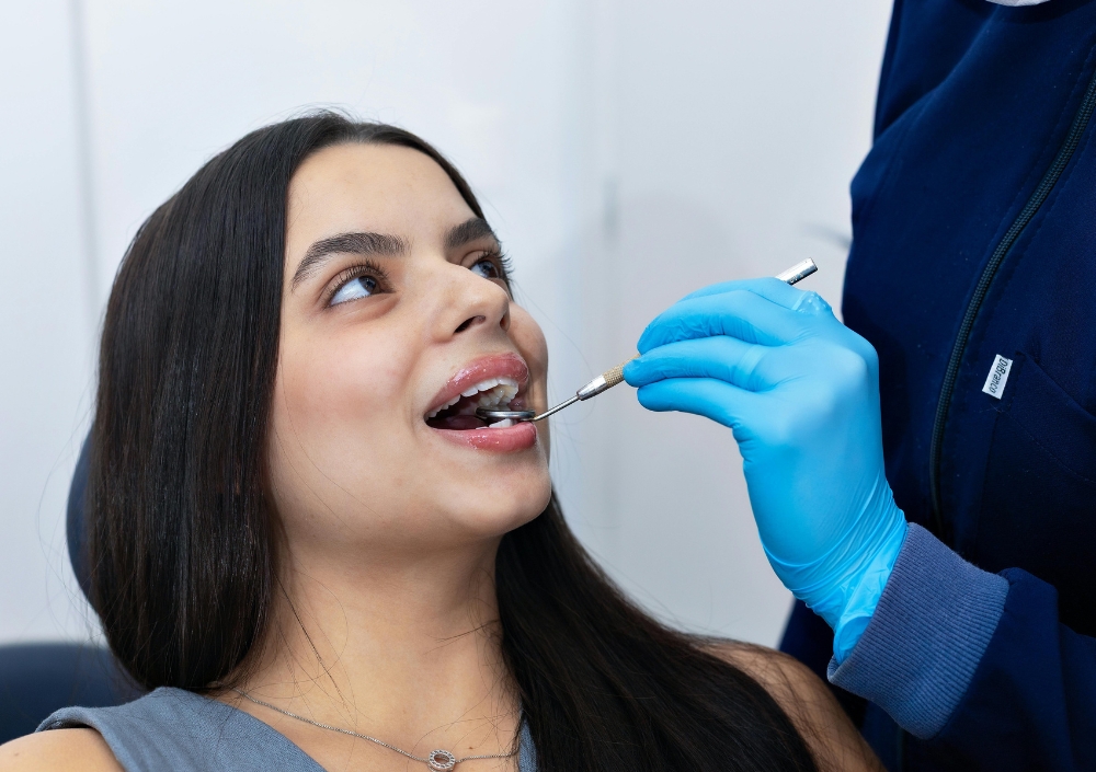 Dentist examining a patient at Goldthorn Dental Practice